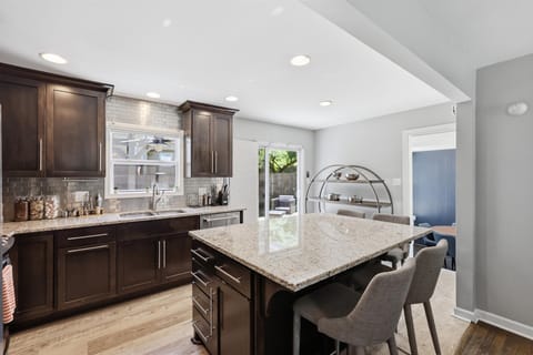 Gather around the oversized island for morning coffee, meals, or planning your Kansas City adventures.