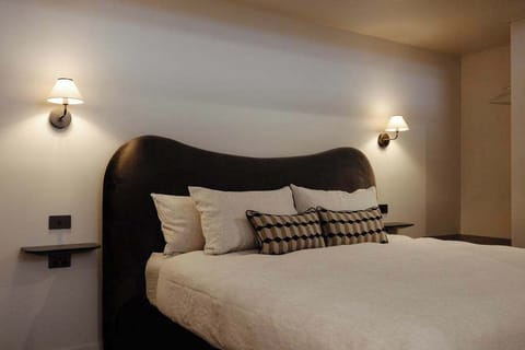 King bed styling designed for deep rest and quiet mornings.