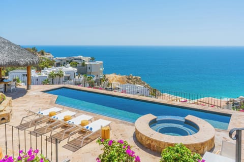 Breathtaking infinity pool overlooking crystal-clear waters, perfect for soaking up sun while enjoying panoramic ocean views.