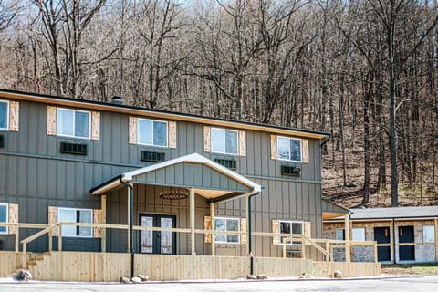 Experience a welcoming exterior set against a serene backdrop of bare trees. Nature is just a step away.