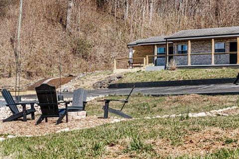 Gather around the fire pit in cozy Adirondack chairs, perfect for relaxing under the stars.