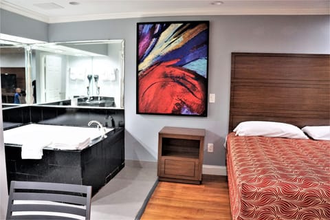 Standard Room, 1 King Bed, Jetted Tub | Iron/ironing board, free WiFi, bed sheets