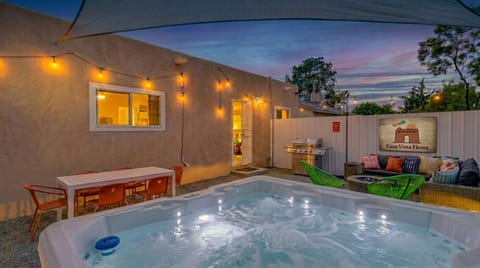 Hot tub glowing at dusk, string lights above, and the whole backyard to yourselves. This is the moment you booked it for — private hot tub, fire pit, and a New Mexico sky that doesn`t disappoint. Albuquerque vacation rental with private hot tub.