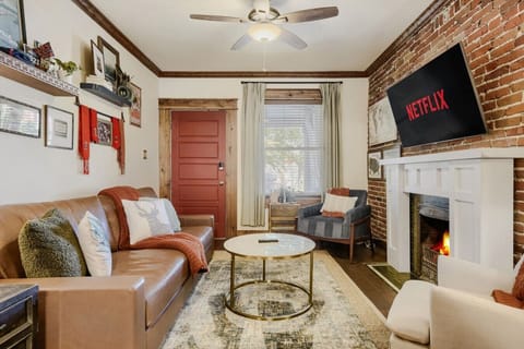 Living room with smart TV and decorative fireplace