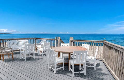 Dine, unwind, and take in sweeping ocean views from the spacious waterfront deck.