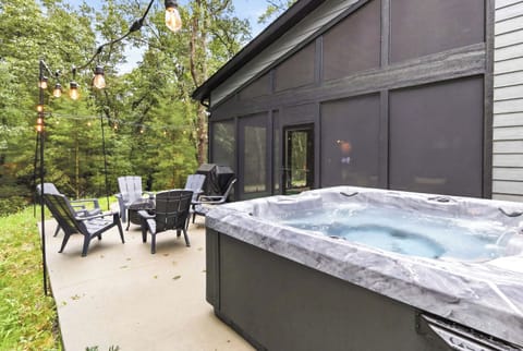 Hot tub evenings feel effortless here, with string lights, wooded views, and plenty of space to unwind outdoors.
