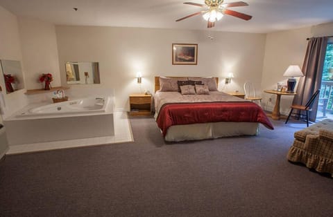 Room, 1 King Bed, Jetted Tub | Blackout drapes, iron/ironing board, free WiFi, bed sheets