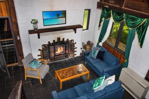 Cozy fireplace lounge with forest views and spacious seating