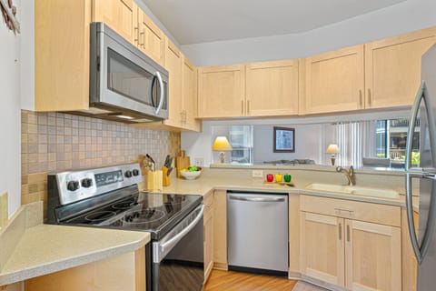 Whether you're preparing breakfast before a beach day or gathering for dinner after sunset, the fully equipped kitchen makes meal preparation simple and convenient.