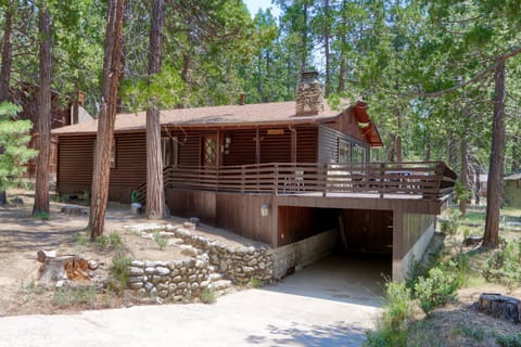 Front of the cabin with a carport