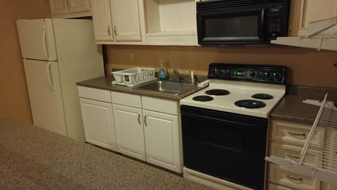 Corporate Suite, Kitchen, 1 King 2 Double Beds | Private kitchen | Fridge, microwave