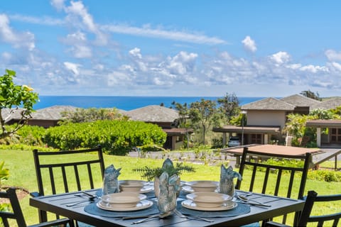 Enjoy the view of the wide lawn and the Pacific Ocean from your private lanai