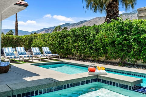 Resort-style pool and spa with mountain views