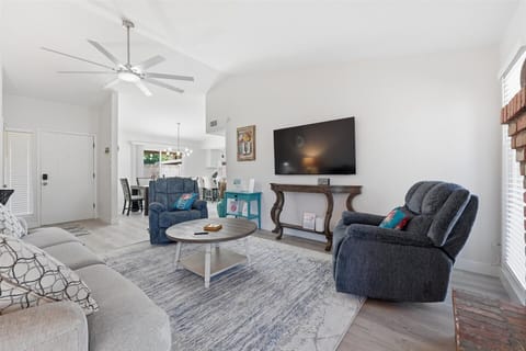 Enjoy the relaxing living room with a 65" TV, Brand new queen sleeper
