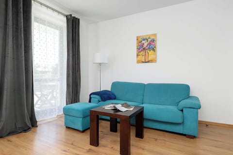 Relax in the stylish living room with a comfortable sofa and modern decor.