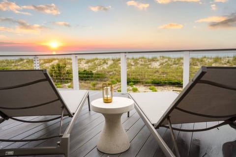 Watch sunrise over the ocean from your private deck