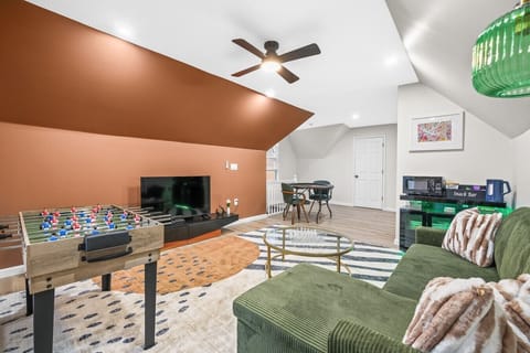 The ultimate hangout space complete with a TV, games, and plenty of room to relax.