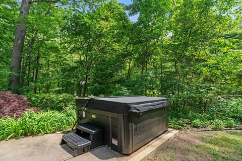Private hot tub tucked into a serene, wooded backyard retreat