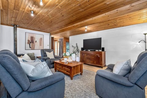 Cosy lounge with recliners & wood fire