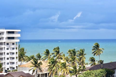 Wake up to beautiful coastal scenery just steps from the beach.