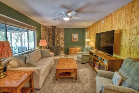 Relax and unwind in the cozy living area, perfect for movie nights and gathering with family and friends.