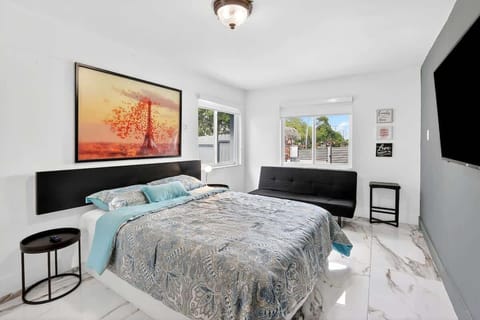 Comfortable queen bed with hotel-quality linens for a restful night's sleep