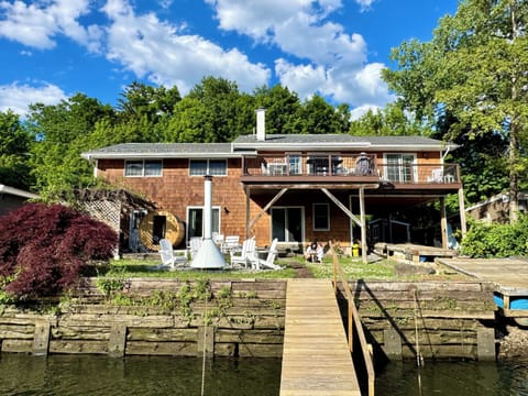 Waterfront retreat with private dock access and panoramic river views