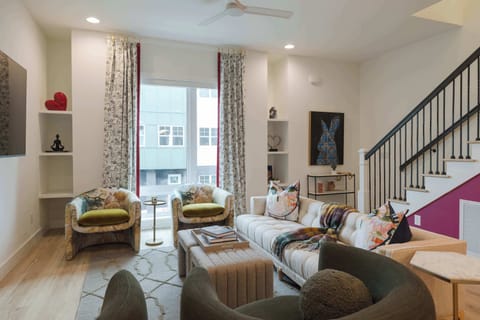 Bright, stylish living room with cozy seating and modern decor.