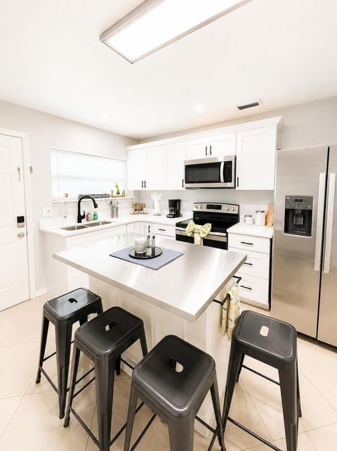 microwave, kitchen  indoor,  coffee maker, kitchen, oven, refrigerator, stovetop