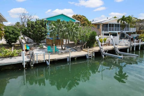Yellowtail Retreat's private dock and tropical waterfront setting create the perfect backdrop for boating, fishing, and relaxing in the Florida Keys.