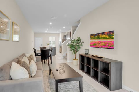 Living Area: Bright and inviting space with stylish decor and fun movie nights await!