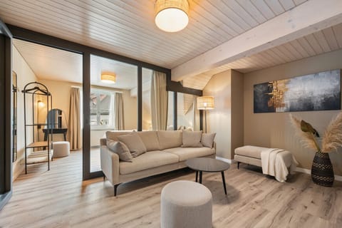 Relax and unwind in a warm, elegant living space designed for cozy evenings, quiet mornings, and effortless comfort throughout your stay.