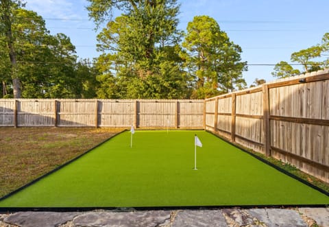 The private putting green adds a fun, playful touch and is perfect for friendly competition without leaving the house.