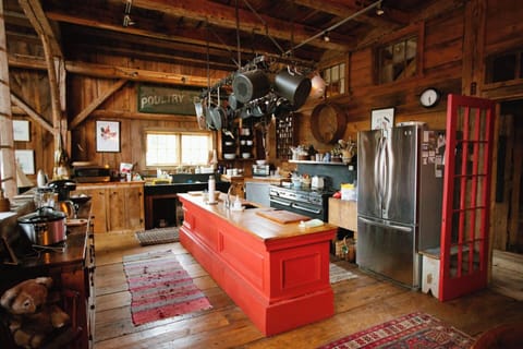 Cook's Kitchen. Old store counter center island, hotel pot rack, a grand antique Julia Child's style stove and awesome slate sink will excite even the most creative cook.