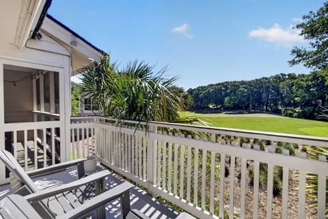 Relax on your private balcony overlooking lush fairways. Sip morning coffee while tropical breezes and natural greenery surround you—your peaceful escape awaits.