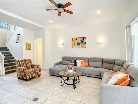 Living Room Retreat: Stylish seating and vibrant decor create a welcoming space for relaxation!