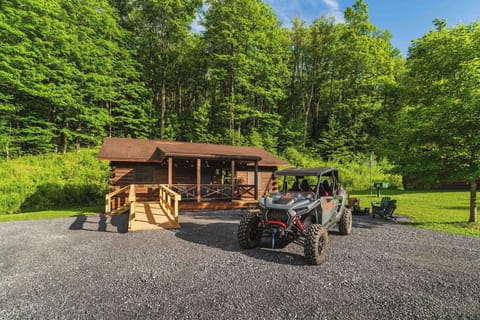 🛻 Park your UTV right at the cabin — trails start steps away. *(The UTV shown is not included — rentals available next door from our partners at Denton Go.)*