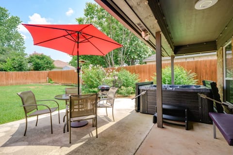 Fenced backyard with covered patio, 5 person hot tub for use all year, lighting,