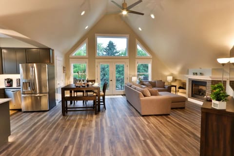 Vaulted ceilings and large windows fill the great room with natural light.