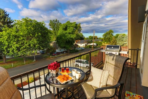 Balcony seating offers a relaxing spot for coffee, drinks, or a meal.
