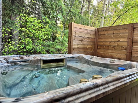 Enjoy a relaxing soak surrounded by trees