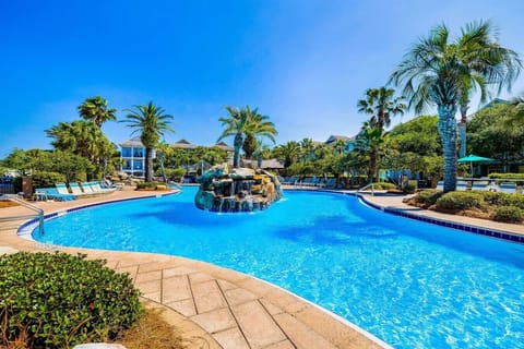 A resort-worthy escape where a freeform pool and waterfall set the scene.