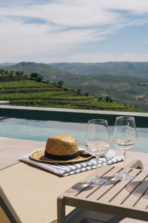 Seasonal outdoor pool, open 8:00 AM to 7:00 PM, pool umbrellas