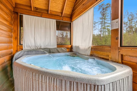 Hot Tub Oasis, unwind in a bubbling sanctuary with nature views, pure bliss awaits!