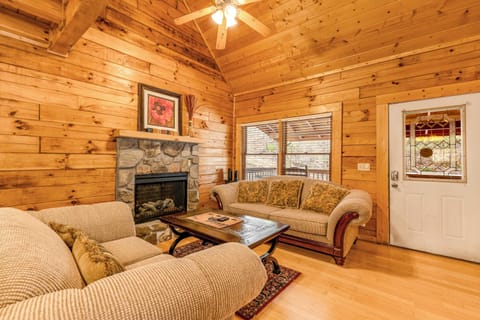 Gather around the stone fireplace and enjoy the natural light and rustic charm!