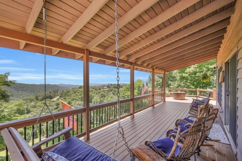 Rock, swing, and relax on this covered mountain-view porch, complete with classic rocking chairs and a charming swing — the perfect spot to soak in fresh air and sweeping views, morning or night.