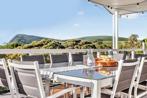 From first light to golden hour, the views from the deck showcase the natural beauty of Second Valley, with rolling hills stretching towards the coast.