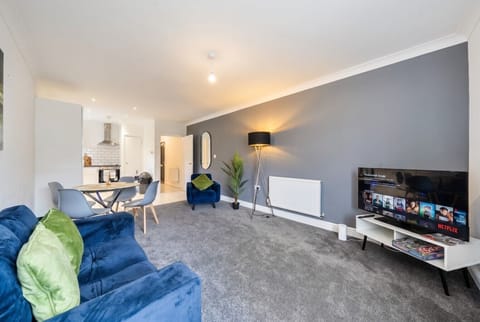 Sink into the velvet sofa for cosy movie nights with Netflix on the big screen