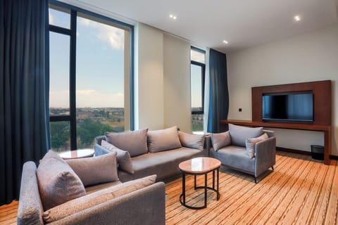 Luxury Double Room, Balcony | Living room | 40-inch Smart TV with digital channels