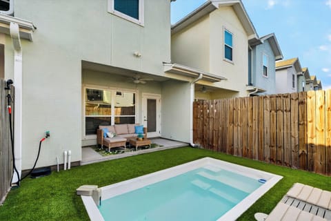 Welcome to your private coastal oasis, featuring a pristine plunge pool and low-maintenance turf backyard.